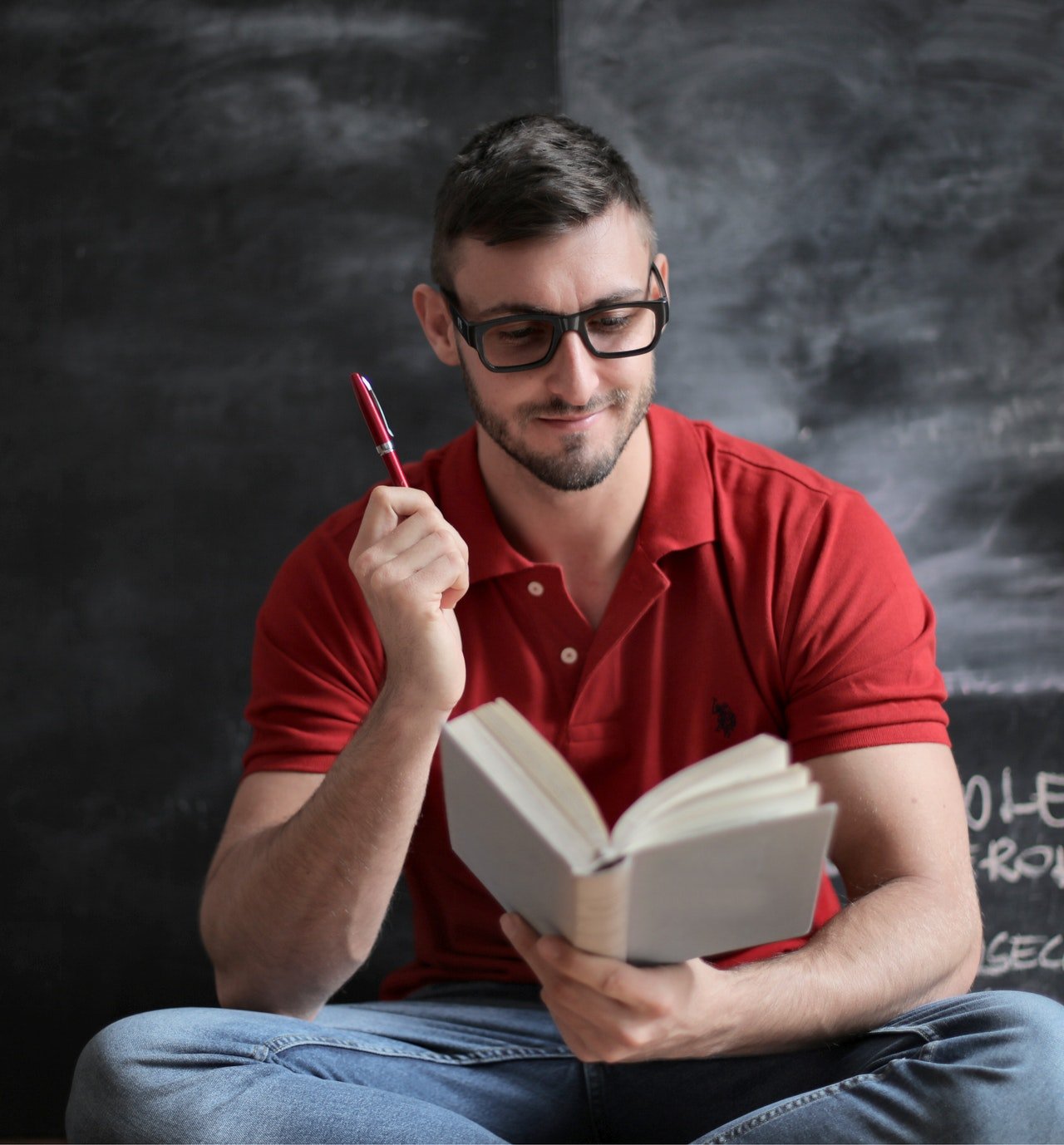 man-in-red-polo-shirt-and-blue-denim-jeans-holding-red-pen-3779488 man-in-red-polo-shirt-and-blue-denim-jeans-holding-red-pen-3779488
